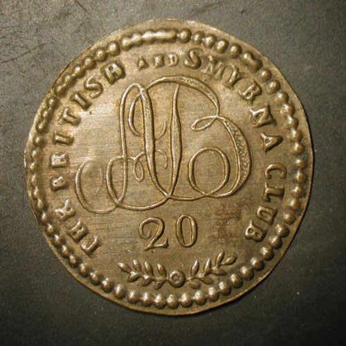 Embossed brass token of the British and Smyrna Club